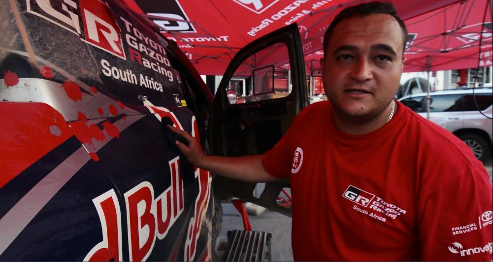 Warren Naudé beside the Toyota Gazoo Racing South Africa rally vehicle at Dakar 2017