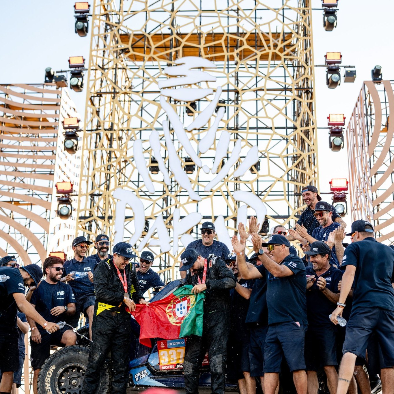 South Racing Can-Am team members celebrating at the finish of the 2024 Dakar Rally